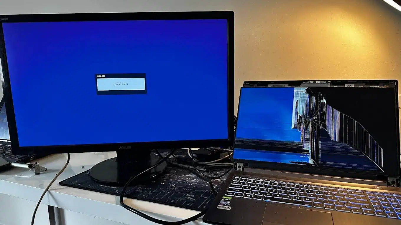 Close-up of a technician using tweezers to carefully connect internal laptop display cables during a screen replacement in our Brisbane workshop.