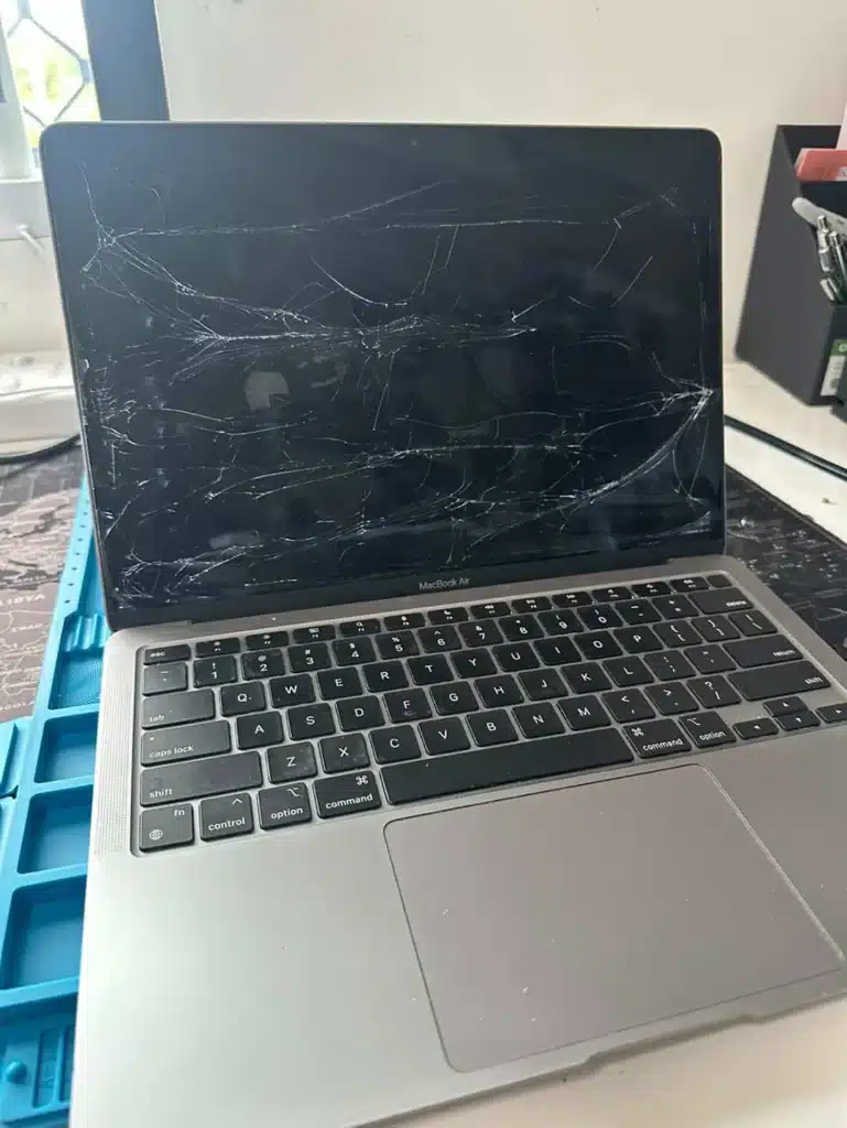 MacBook Air with severely cracked screen before screen replacement repair